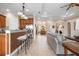 Kitchen with granite counters, tile backsplash, stainless steel appliances and bar seating at 297 Martellago Dr, North Venice, FL 34275