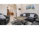 Comfortable seating arrangement in the living room with arched doorway at 297 Martellago Dr, North Venice, FL 34275