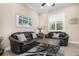 Inviting living room with shuttered windows and ceiling fan at 297 Martellago Dr, North Venice, FL 34275