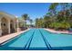 Spacious swimming pool with lane markers, perfect for exercise and recreation in a sunny outdoor setting at 297 Martellago Dr, North Venice, FL 34275