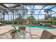 The outdoor space features a pool, spa, and screened enclosure, perfect for enjoying the outdoors at 297 Martellago Dr, North Venice, FL 34275