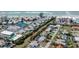 This aerial view showcases a canal-front home with a screened pool and quick access to the Gulf of Mexico at 388 Flamingo Dr, Venice, FL 34285