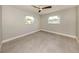 Bright bedroom with tile flooring, neutral walls, and a modern ceiling fan at 388 Flamingo Dr, Venice, FL 34285