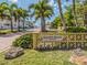 Golden Beach Private entrance with landscaping, leading to a beachside community at 388 Flamingo Dr, Venice, FL 34285