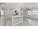 Open-concept kitchen area features a breakfast bar, stainless steel appliances, and ample counter space at 388 Flamingo Dr, Venice, FL 34285