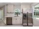 Updated kitchen featuring stainless steel appliances, subway tile backsplash, and modern fixtures at 388 Flamingo Dr, Venice, FL 34285