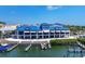 Charming waterfront restaurant featuring docks and a breezy outdoor dining area with water views at 394 Hanchey Dr, Nokomis, FL 34275