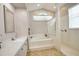 Bathroom showcasing a large soaking tub, separate shower, updated vanity, and neutral decor at 4398 Summertree Rd, Venice, FL 34293