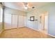 Bedroom with tile flooring, closet, neutral paint, and a view into the attached ensuite bathroom at 4398 Summertree Rd, Venice, FL 34293