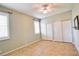 A light-filled bedroom featuring tile floors, large windows, and ample closet space at 4398 Summertree Rd, Venice, FL 34293