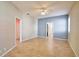 Spacious bedroom featuring tile flooring, neutral walls with blue accent, and ample natural light at 4398 Summertree Rd, Venice, FL 34293