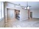 Kitchen with breakfast bar open to dining and living room with lots of natural light at 4398 Summertree Rd, Venice, FL 34293