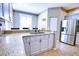 Bright and open kitchen with tile flooring, stainless steel appliances, and granite countertops at 4398 Summertree Rd, Venice, FL 34293