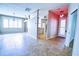 Living room with an open layout, tile floors and lots of natural light at 4398 Summertree Rd, Venice, FL 34293