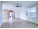 Spacious living area boasting a ceiling fan and an open layout at 4398 Summertree Rd, Venice, FL 34293