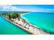Expansive coastal view featuring a beachside parking area, nearby attractions, and clear waters at 471 Bayshore Rd, Nokomis, FL 34275