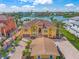 Aerial view of grand waterfront home, mature landscaping, and beautiful tile roof at 471 Bayshore Rd, Nokomis, FL 34275