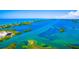 Panoramic aerial view of the waterfront community showcasing waterways, stunning views, and lush surroundings at 471 Bayshore Rd, Nokomis, FL 34275