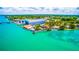 Aerial view of waterfront homes, boat docks and waterways near Tampa, Florida at 471 Bayshore Rd, Nokomis, FL 34275