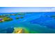 Aerial view showcasing waterway, waterfront homes and the surrounding natural environment at 471 Bayshore Rd, Nokomis, FL 34275