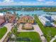 Aerial view of grand home with lush lawns, large driveways and waterfront access at 471 Bayshore Rd, Nokomis, FL 34275
