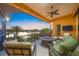 Inviting covered balcony with comfortable seating and stunning views of the water at 471 Bayshore Rd, Nokomis, FL 34275
