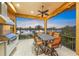 Outdoor patio offering dining area with grill and sunset views, perfect for entertaining at 471 Bayshore Rd, Nokomis, FL 34275