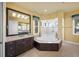 Luxurious bathroom with a soaking tub, spacious shower, and vanity at 471 Bayshore Rd, Nokomis, FL 34275