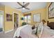 Cozy bedroom with a map of Florida, ceiling fan, and an en suite bathroom at 471 Bayshore Rd, Nokomis, FL 34275