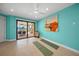 Bright bedroom with tile floors, a ceiling fan, and sliding glass doors to the outdoor patio at 471 Bayshore Rd, Nokomis, FL 34275