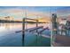 Dockside view of boat lift and water access in a waterfront neighborhood at 471 Bayshore Rd, Nokomis, FL 34275