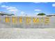 Nokomis Community sign in front of beautiful blue skies and foliage at 471 Bayshore Rd, Nokomis, FL 34275