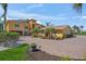 Spacious driveway with lush landscaping leading to a beautiful home at 471 Bayshore Rd, Nokomis, FL 34275