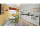 Cozy eat-in kitchen with white cabinets and modern appliances at 471 Bayshore Rd, Nokomis, FL 34275