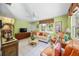 Inviting living room featuring tile floors, large windows, and comfortable seating at 471 Bayshore Rd, Nokomis, FL 34275