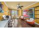 Bright office with hardwood floors, a ceiling fan, and large art on the wall at 471 Bayshore Rd, Nokomis, FL 34275