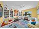 Well-lit home office with built-in bookshelves and desk overlooking the water at 471 Bayshore Rd, Nokomis, FL 34275