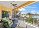 Outdoor patio with comfortable seating, ceiling fan and expansive views of the waterway at 471 Bayshore Rd, Nokomis, FL 34275