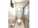 Bathroom with toilet, shower and safety bars at 495 Schooner St, North Port, FL 34287