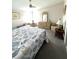 Relaxing bedroom featuring soft lighting, seashell-themed bedding, and cozy seating at 495 Schooner St, North Port, FL 34287