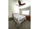 Comfortable bedroom featuring a ceiling fan, and a large window at 495 Schooner St, North Port, FL 34287