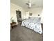 Bright bedroom with seashell bedding, ensuite bathroom access, and convenient furniture layout at 495 Schooner St, North Port, FL 34287