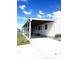 Spacious carport offers covered parking and convenient access to home's entrance with lake views at 495 Schooner St, North Port, FL 34287