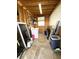Functional laundry room with a washer, storage shelves, and utility sink at 495 Schooner St, North Port, FL 34287