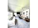 Living room featuring a large window, ceiling fan and two couches at 495 Schooner St, North Port, FL 34287