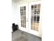 Sunroom showing glass pane doors and an older style heater at 495 Schooner St, North Port, FL 34287