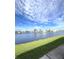 Scenic water view showcasing a tranquil lake surrounded by homes in a serene community with blue skies at 495 Schooner St, North Port, FL 34287