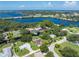 Panoramic aerial showcasing waterway access and lush greenery, highlighting the neighborhood's coastal charm at 501 Dona Dr, Nokomis, FL 34275