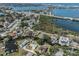Waterfront community view with lush greenery, serene canal, and convenient city access at 501 Dona Dr, Nokomis, FL 34275
