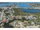 Waterfront community view with lush greenery, serene canal, and convenient city access at 501 Dona Dr, Nokomis, FL 34275